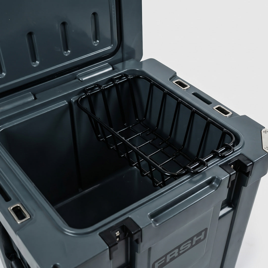 FRSH 33L hard cooler basket, a durable accessory for 33-liter coolers, shown in black with sturdy handles and ventilation holes.