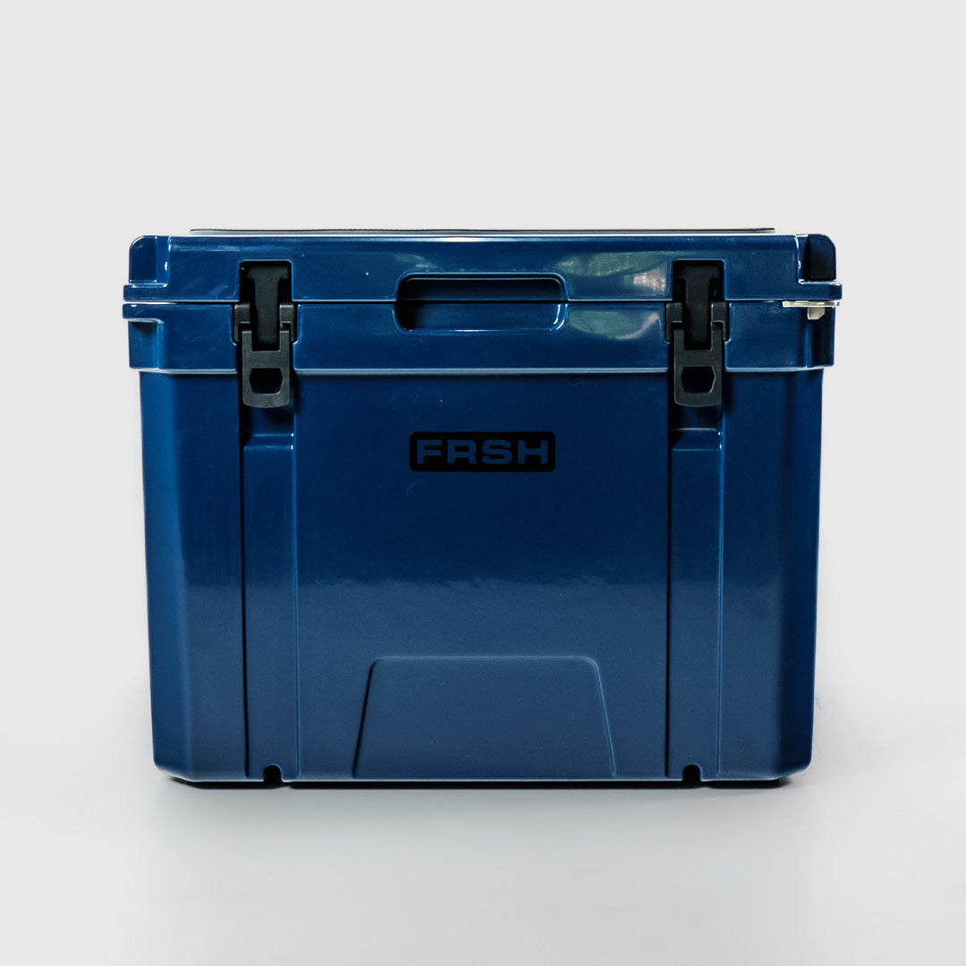 FRSH 55L hard cooler in frozen blue with sturdy handle and secure latch, ideal for outdoor cooling and keeping items cold.
