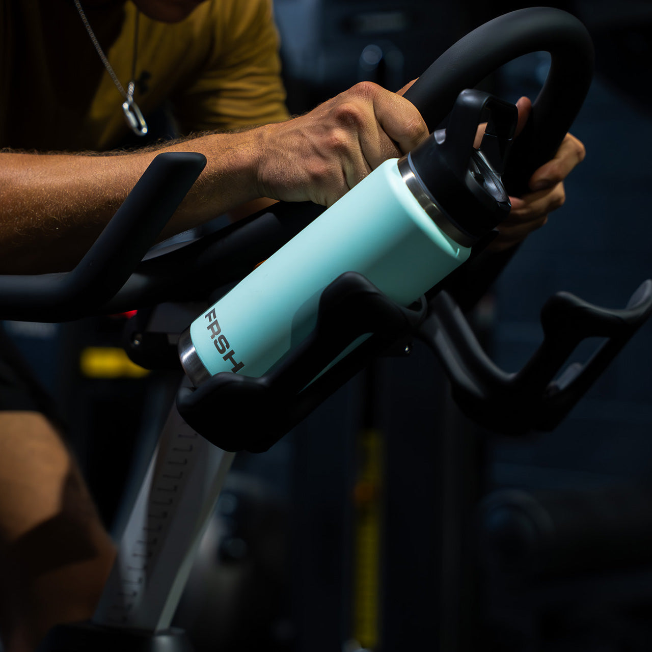 FRSH 750ml water bottle with sip lid, stainless steel design, and ergonomic shape for easy hydration.