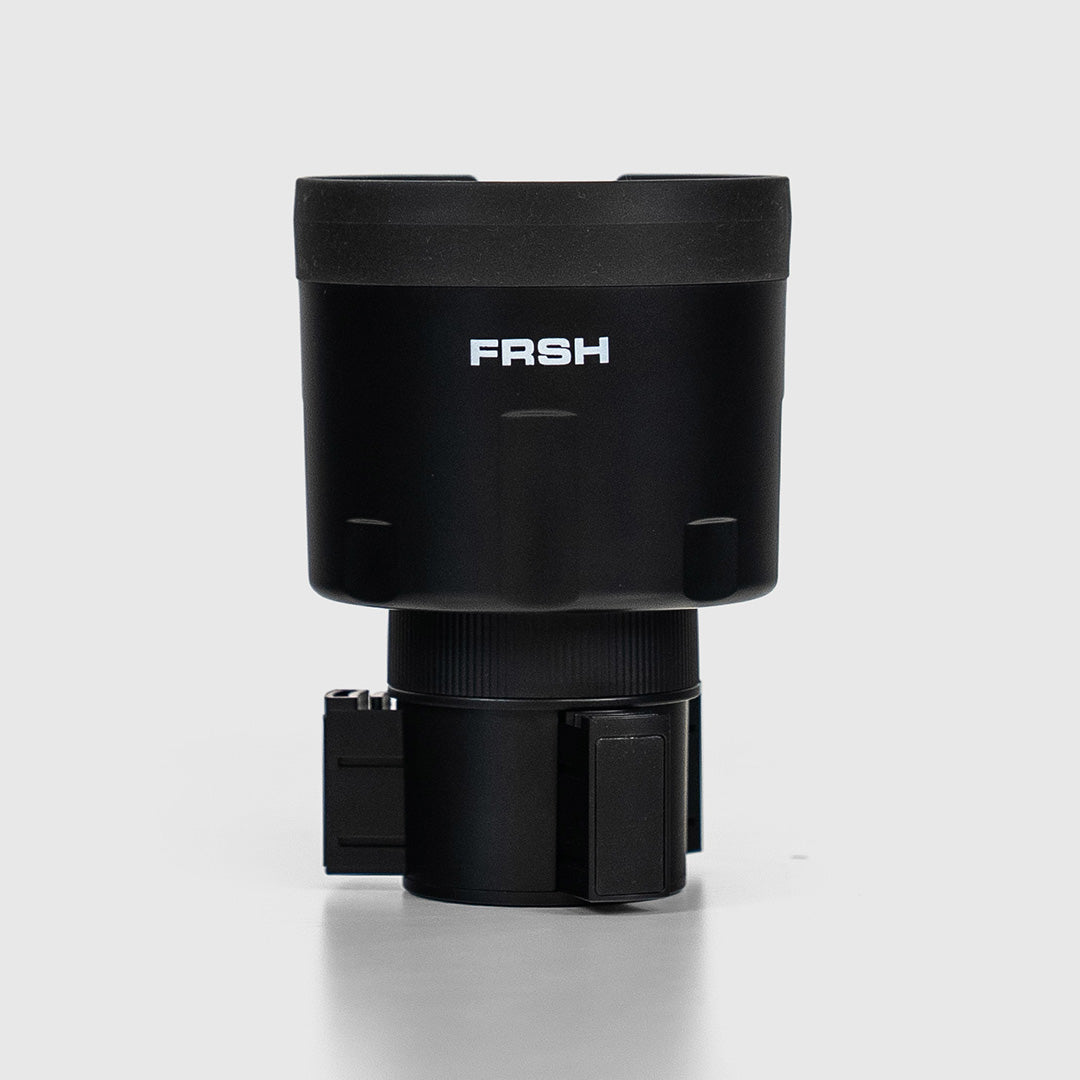 FRSH car bottle holder mounted in vehicle interior, designed to securely hold water bottles and keep the car organized.