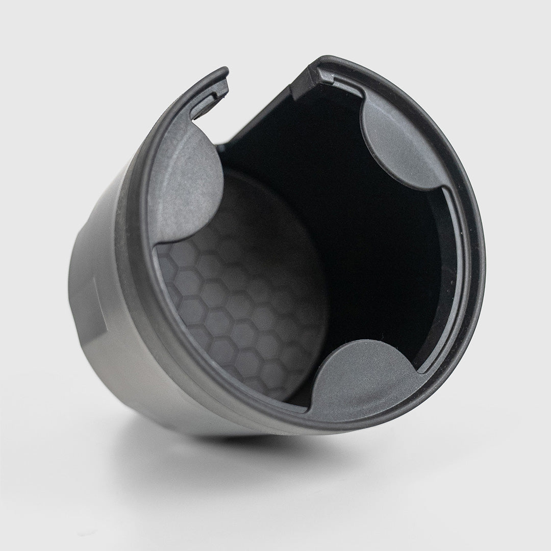 FRSH car bottle holder attached to vehicle interior, designed to securely hold water bottles and keep them accessible while driving.