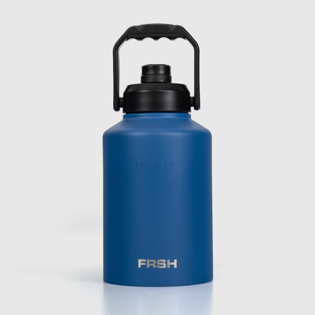 Dark blue 3.8L FRSH bottle with chug lid, durable plastic water bottle for sports and outdoor activities.