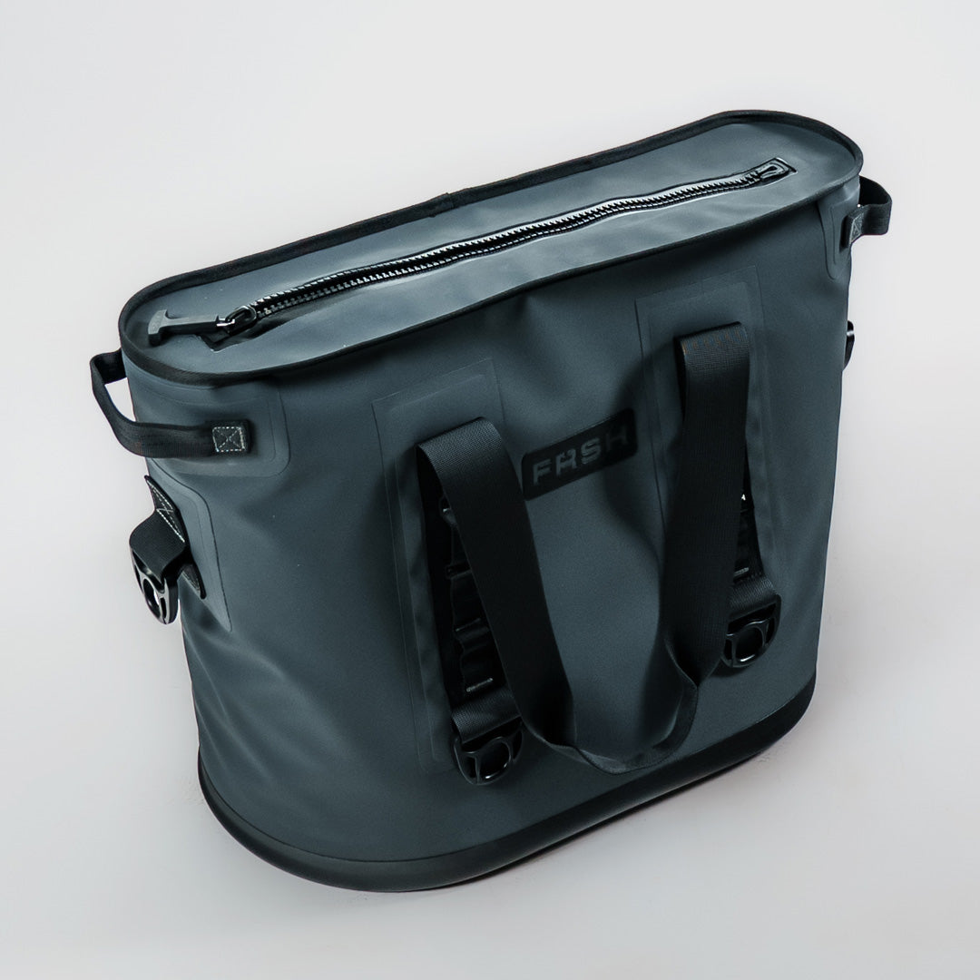 FRSH 30L soft cooler with carbon-colored exterior, insulated fabric, and adjustable shoulder strap for portable cooling.