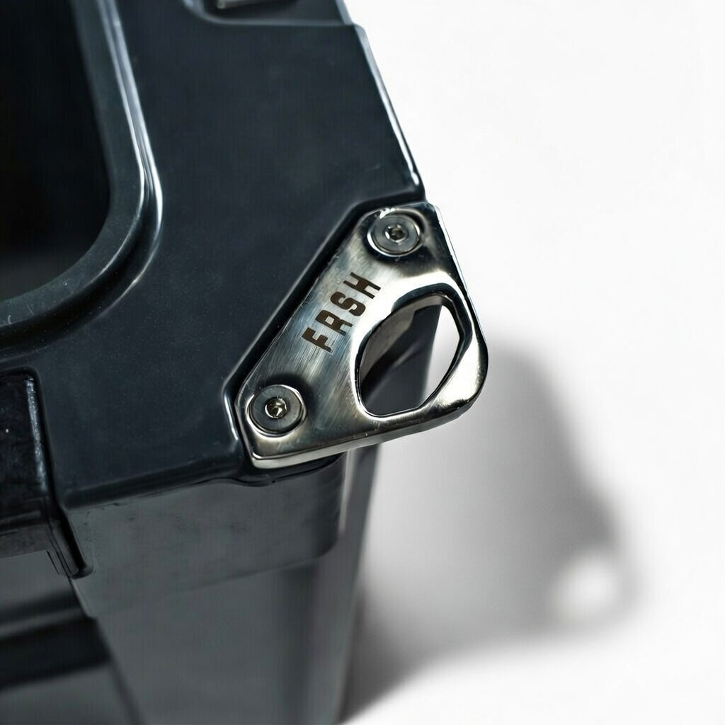 FRSH 33L hard cooler with sturdy insulated design, featuring a secure lid and side handles for easy carrying.