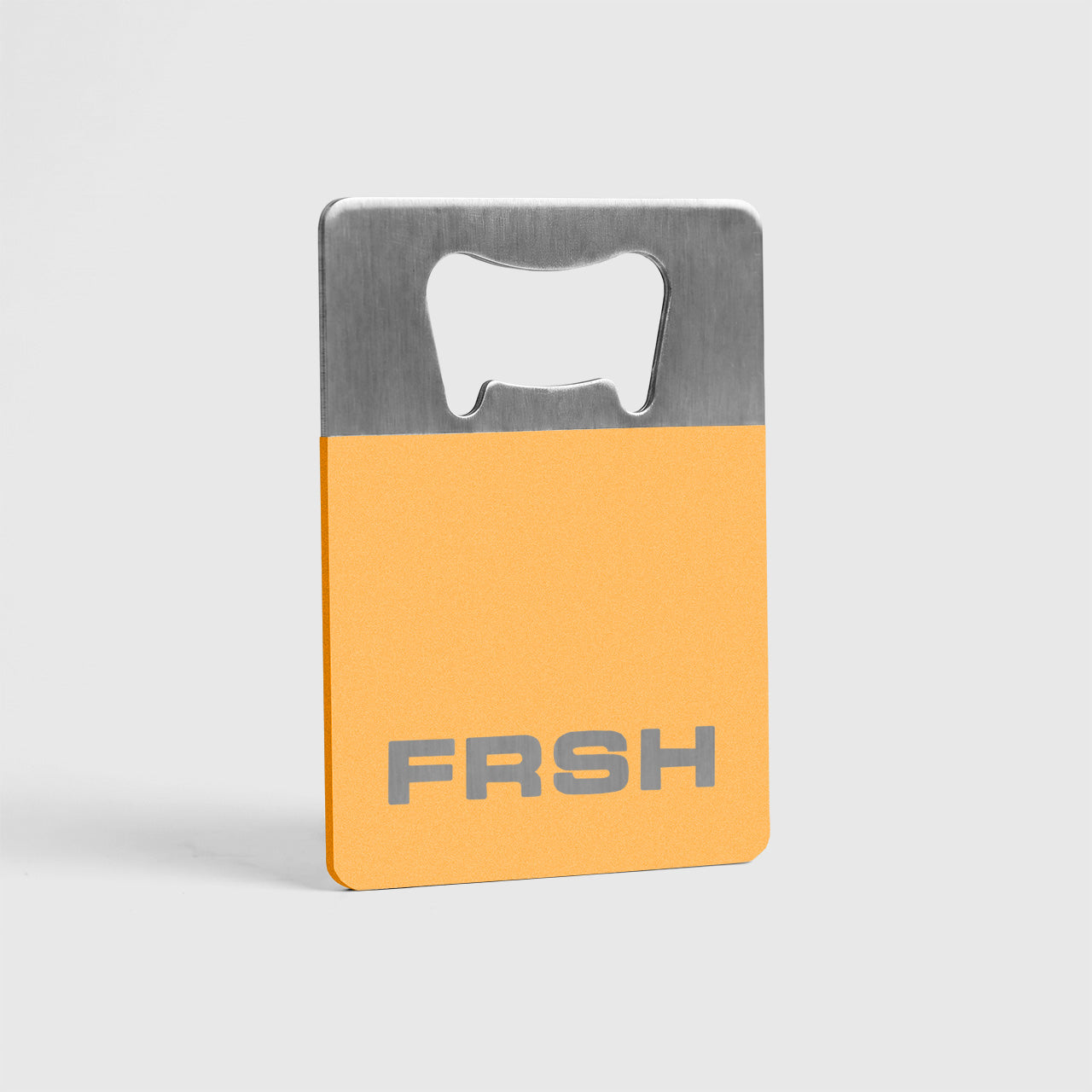 FRSH bottle opener in citrus orange color, a sleek kitchen accessory for opening bottles easily and stylishly