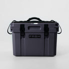 FRSH 17L hard cooler with carbon finish, rugged plastic exterior, and secure lid for outdoor insulation and portability.