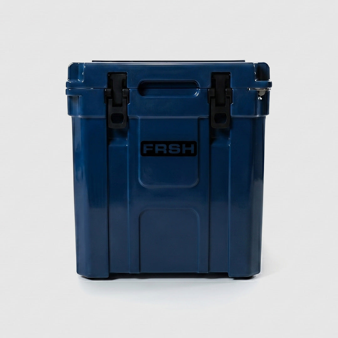 FRSH 33L hard cooler in frozen blue with sturdy handles and secure latches, ideal for outdoor and camping use.