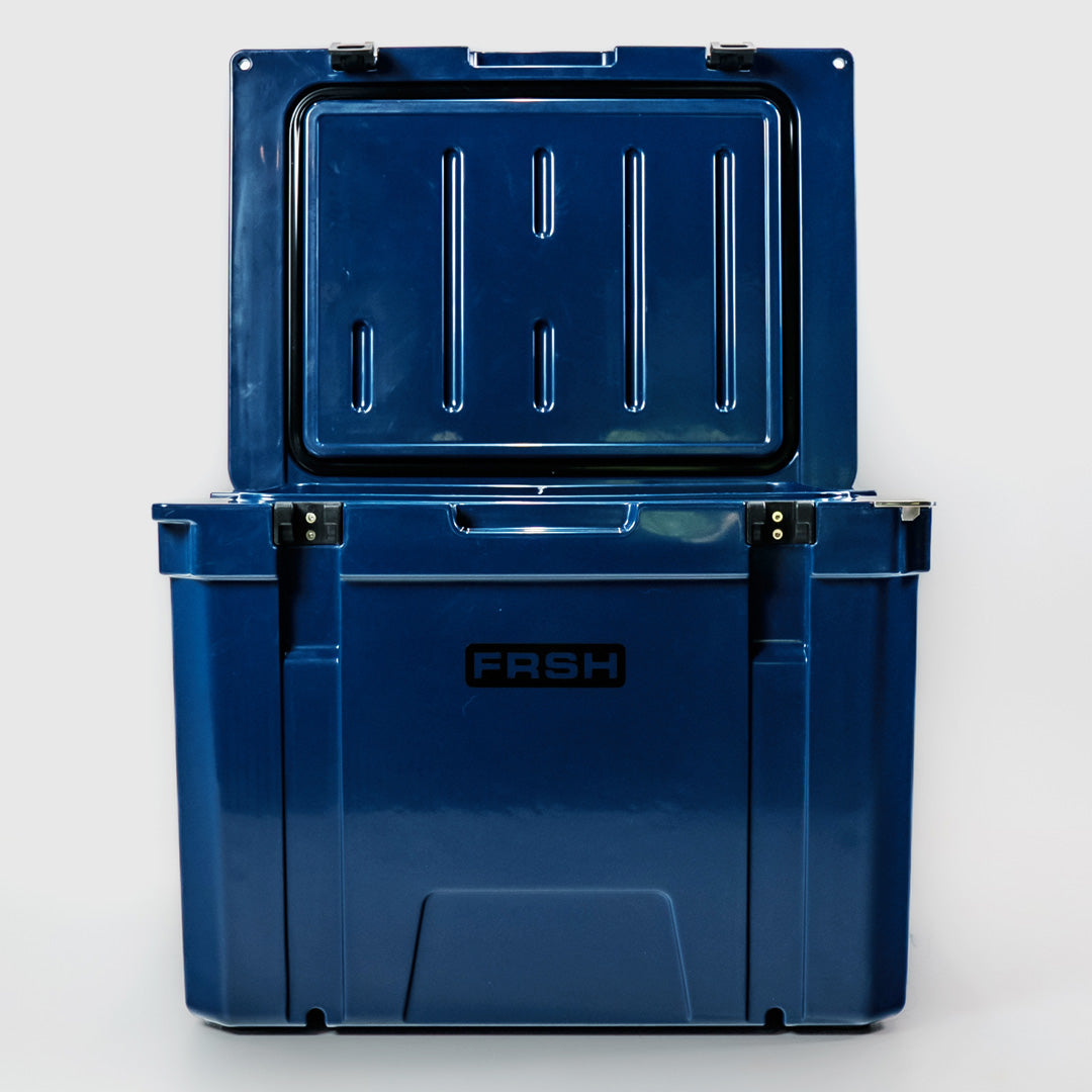 FRSH 55L hard cooler in frozen blue with sturdy construction and secure lid, ideal for outdoor camping and picnics