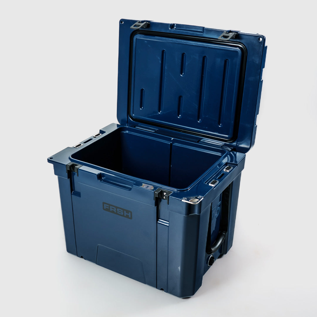 FRSH 55L frozen blue hard cooler with sturdy handle and secure latch, designed for outdoor and camping use.
