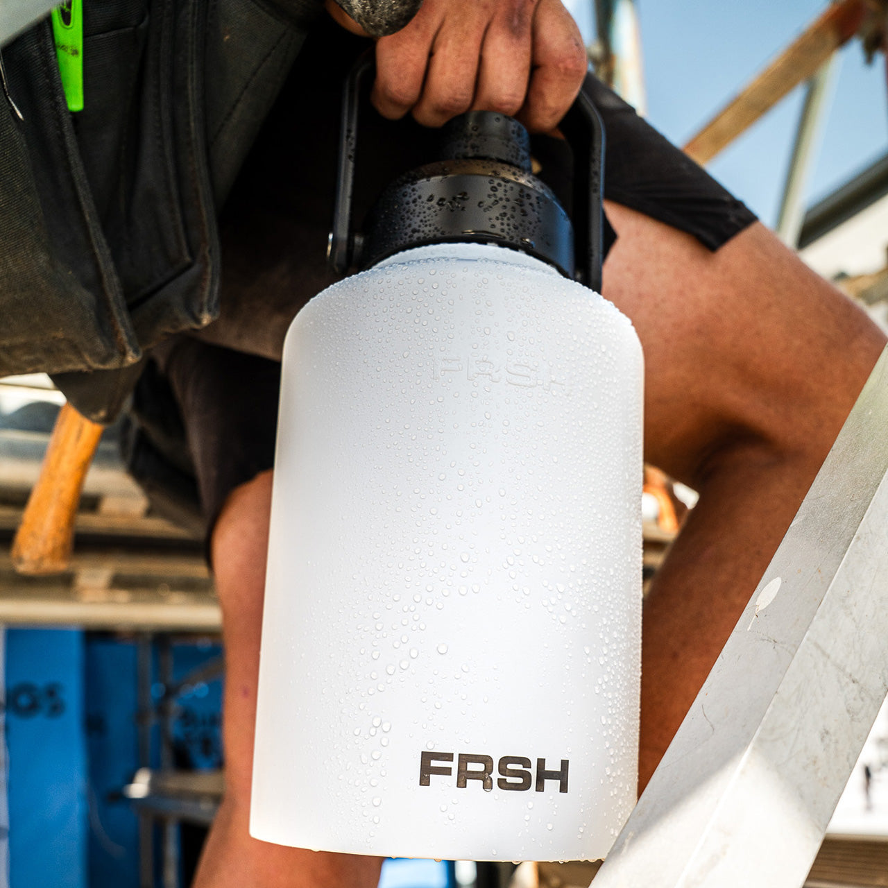 FRSH 3.8L water bottle with chug lid, durable plastic sports bottle with large capacity and ergonomic design.